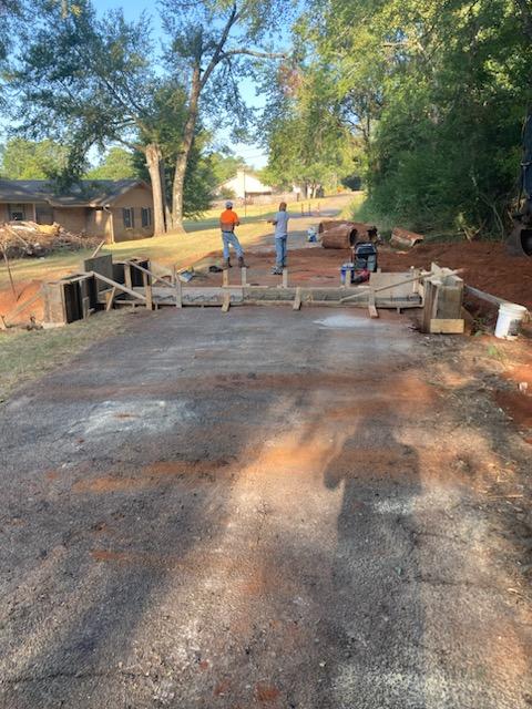 men working on culvert/road